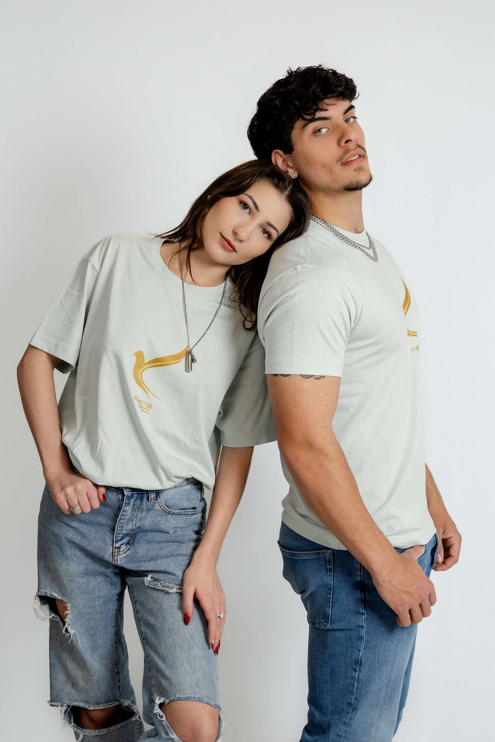 a male and feamle model wearing KR bird logo seafoam tee posing 3